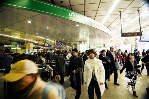 Shinjuku station crowd rushing during the peak hour