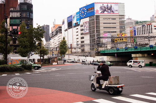 Shinjuku Street, man on three wheel bike