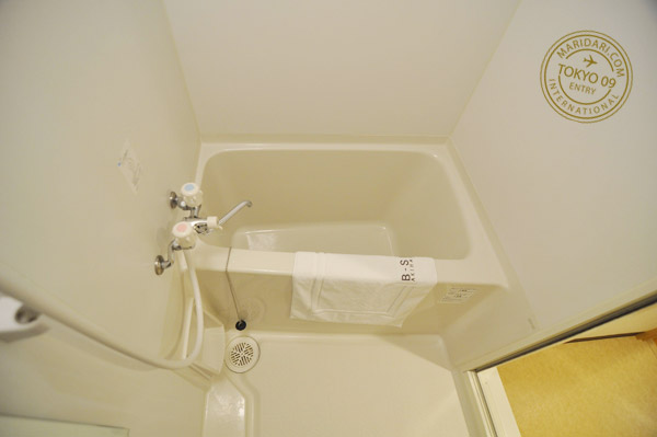 Small bathtub in bathroom of B-SITE Akihabara Tokyo Apartment