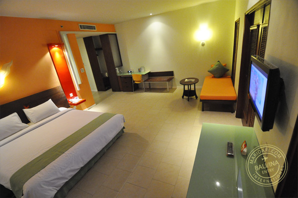 All Seasons Legian Bali - image of bedroom showing queen bed, daybed, desk