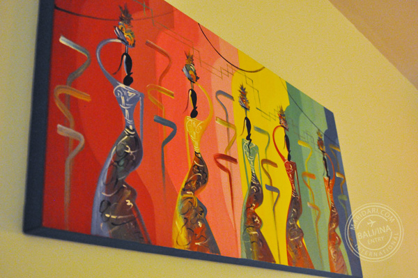 All Seasons Legian Bali review - decor of hotel bedroom, painting of Balinese women balancing pots on their heads